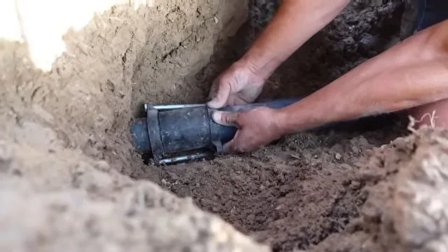 Aligning water pipe repair sleeve, part of a San Tan Valley plumbing repair